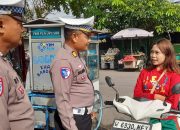 Kanit Lantas Polsek Taman Tegur Pengendara Roda Dua Yang Tidak Pake Helm 